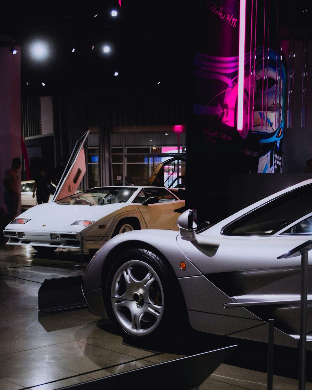 Legendary sports car displayed in a dark virtual museum gallery setting